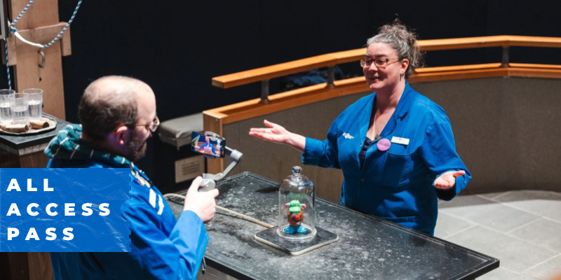 two bluecoats performing a science experiment together